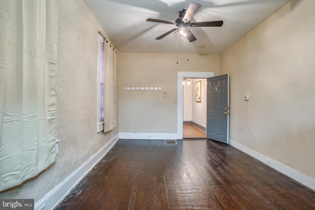 a view of an empty room and window