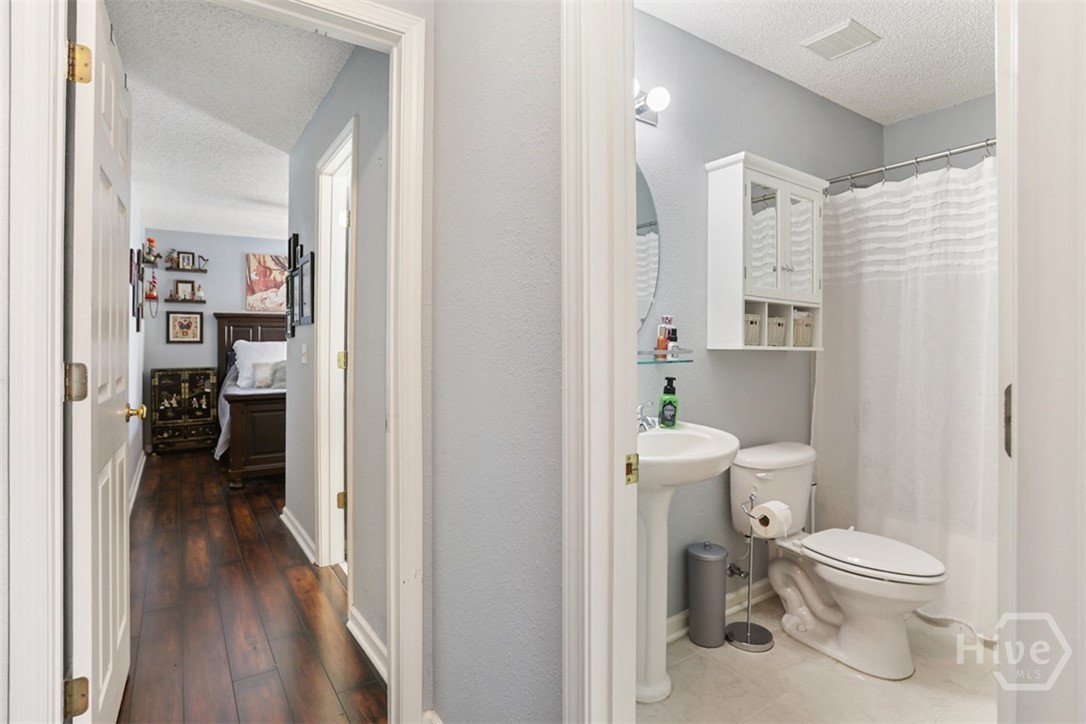 120 Trellis Way Savannah, GA 31419 - Photo 25 of 36 2nd Bathroom to right, entrance to Primary Suite on left