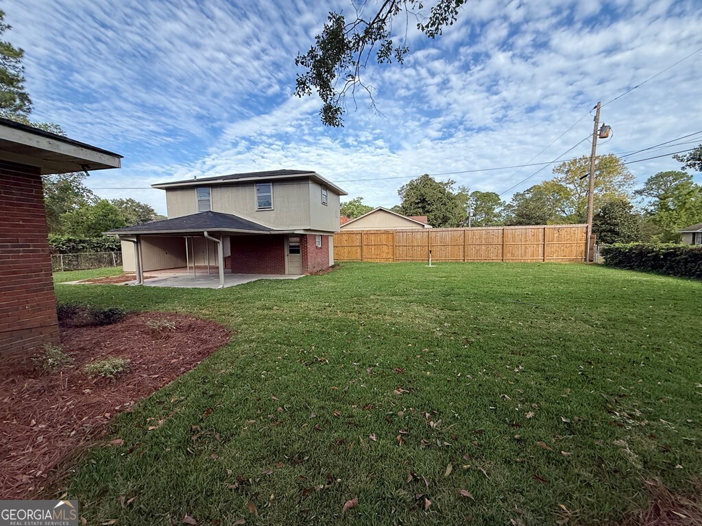 412 Roberson Street Dublin, GA 31021 - Photo 12 of 54 a view of a yard in front of house