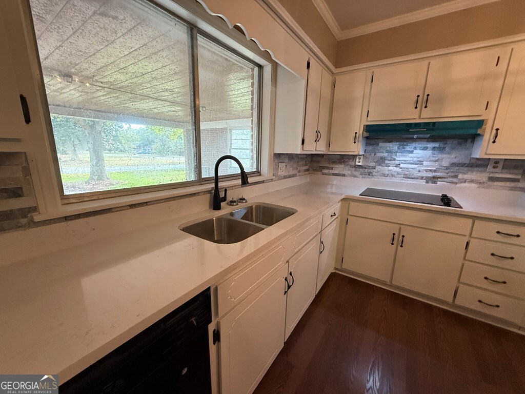412 Roberson Street Dublin, GA 31021 - Photo 26 of 54 a kitchen with sink and cabinets