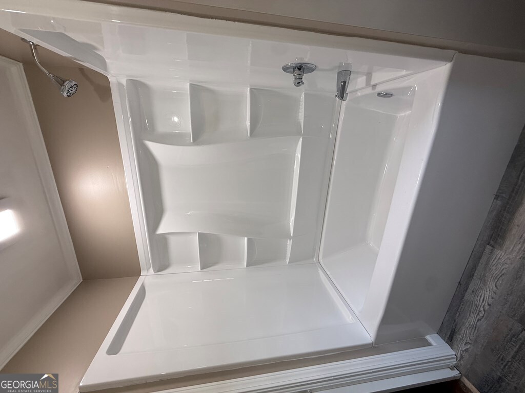 412 Roberson Street Dublin, GA 31021 - Photo 39 of 54 a bathroom with a sink and mirror with toilet