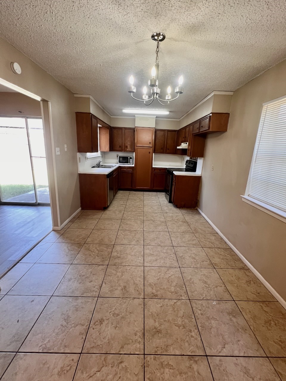 1650 Shirley Circle Beaumont, TX 77707 - Photo 6 of 14 a large kitchen with stainless steel appliances a counter space and cabinets