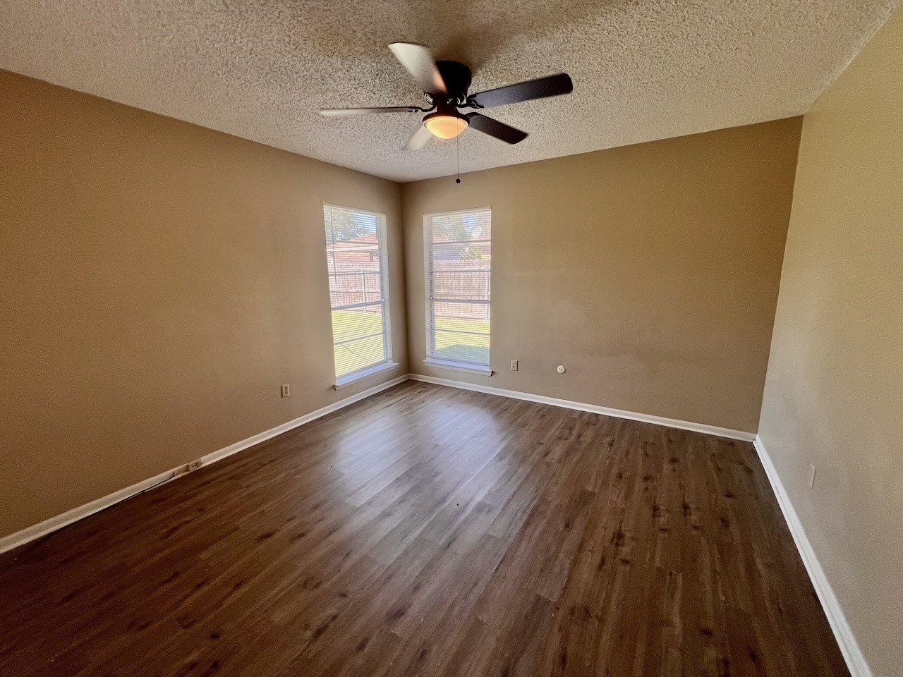 1650 Shirley Circle Beaumont, TX 77707 - Photo 7 of 14 a view of an empty room with wooden floor and a window