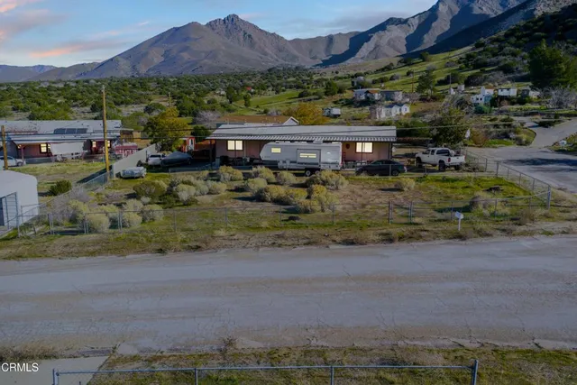 a view of house with a garden and a lake view