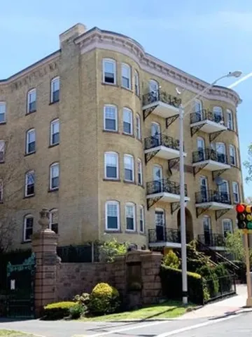 a front view of a building with street view