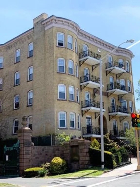175 Maple Street, Unit 4R Springfield, MA 01105 - Photo 1 of 10 a front view of a building with street view