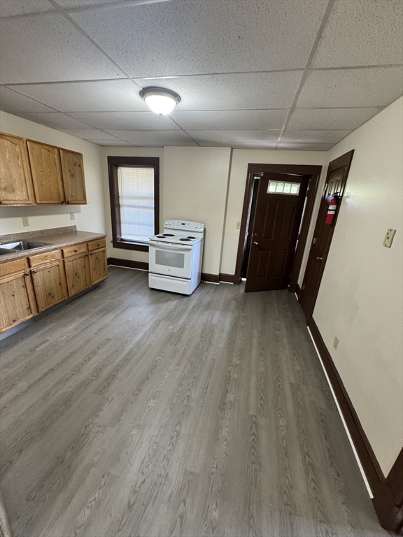 175 Maple Street, Unit 4R Springfield, MA 01105 - Photo 4 of 10 a view of an empty room with window and wooden floor