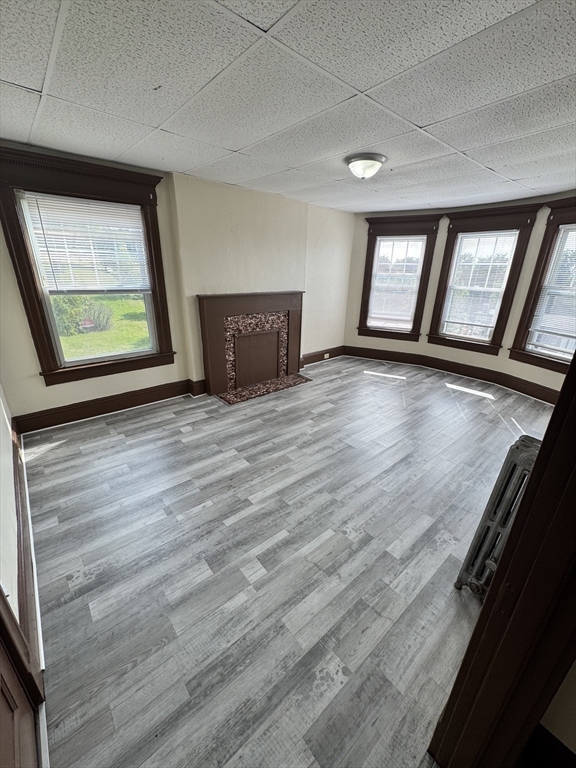 175 Maple Street, Unit 4R Springfield, MA 01105 - Photo 10 of 10 wooden floor in an empty room with a window
