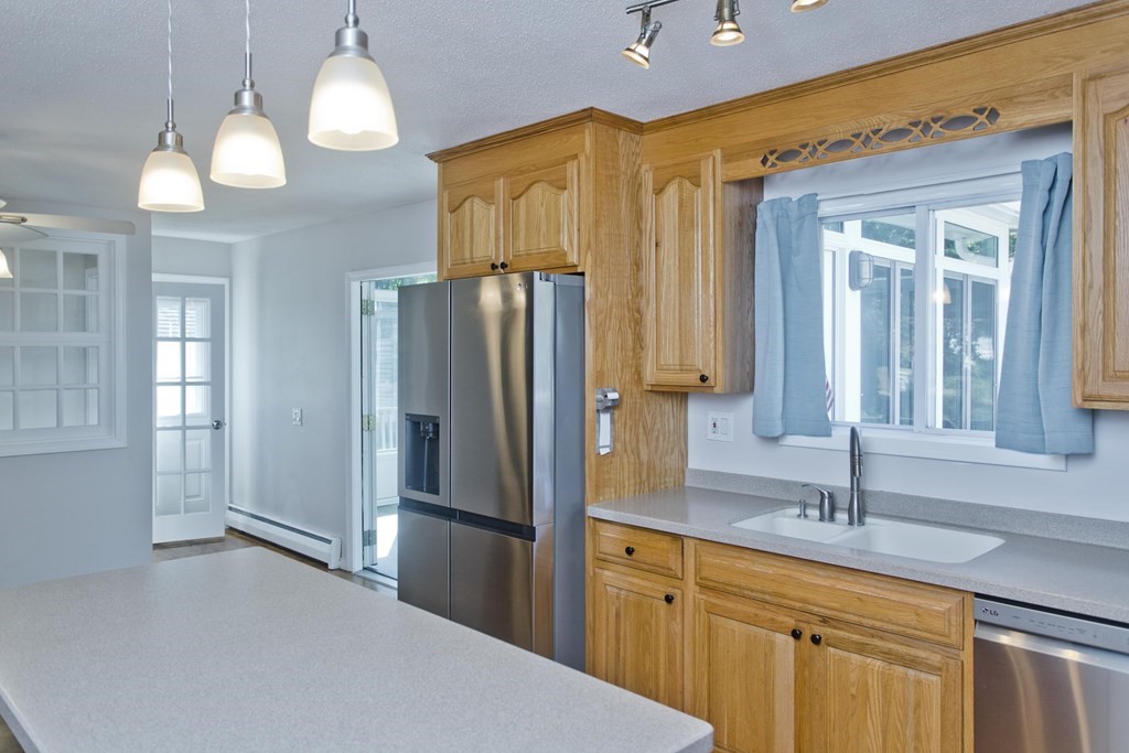 61 Arbor Road Enfield, CT 06082 - Photo 13 of 39 a kitchen with stainless steel appliances a refrigerator and a sink