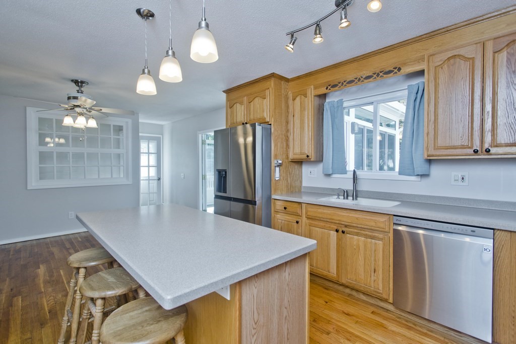 61 Arbor Road Enfield, CT 06082 - Photo 14 of 39 a kitchen with stainless steel appliances granite countertop a sink refrigerator and cabinets