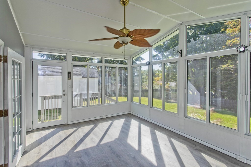 61 Arbor Road Enfield, CT 06082 - Photo 15 of 39 a view of empty room with wooden floor and fan