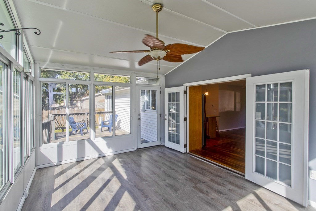 61 Arbor Road Enfield, CT 06082 - Photo 18 of 39 a view of an empty room with wooden floor and a window