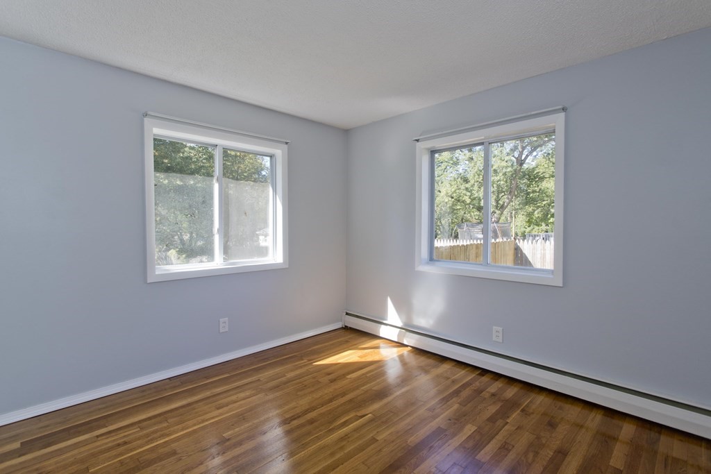 61 Arbor Road Enfield, CT 06082 - Photo 19 of 39 a view of empty room with wooden floor and fan