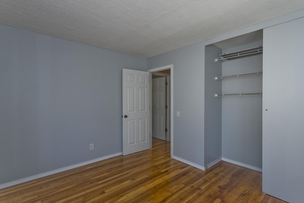 61 Arbor Road Enfield, CT 06082 - Photo 21 of 39 a view of an empty room with closet and wooden floor