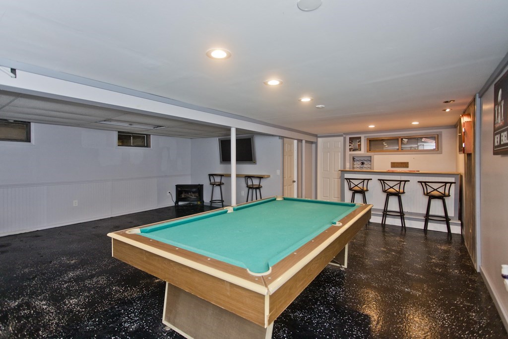 61 Arbor Road Enfield, CT 06082 - Photo 28 of 39 a room with pool table table and a fireplace