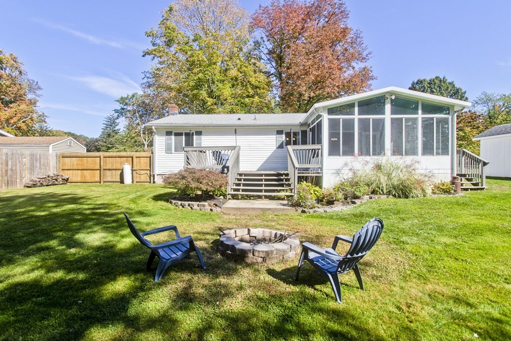 61 Arbor Road Enfield, CT 06082 - Photo 32 of 39 a view of a house with backyard sitting area and garden