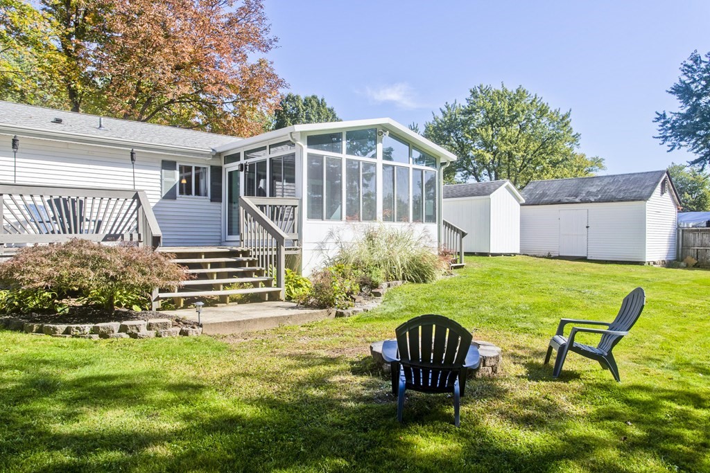 61 Arbor Road Enfield, CT 06082 - Photo 33 of 39 a house view with a seating space and garden