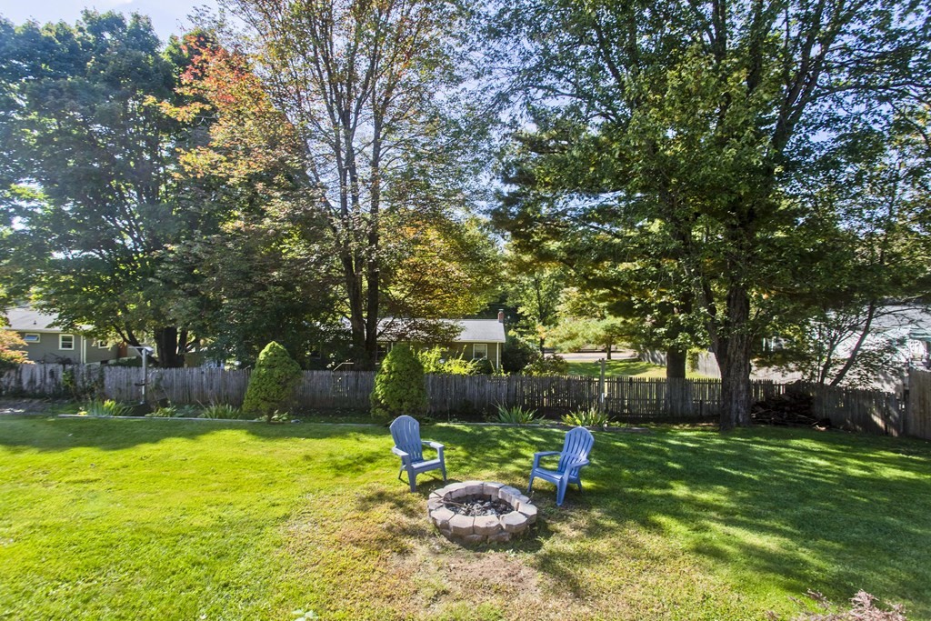 61 Arbor Road Enfield, CT 06082 - Photo 36 of 39 a front view of a house with garden and a tree