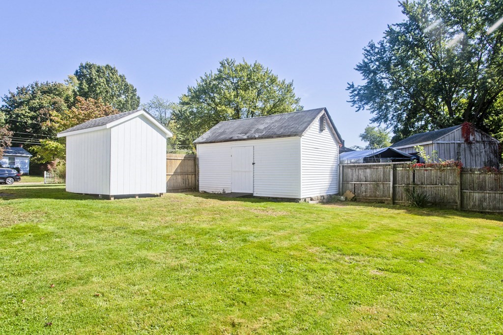 61 Arbor Road Enfield, CT 06082 - Photo 37 of 39 a view of a backyard with a garden and tree