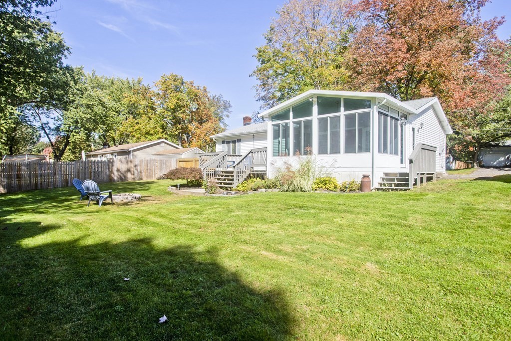 61 Arbor Road Enfield, CT 06082 - Photo 39 of 39 a white house with a small yard and large trees