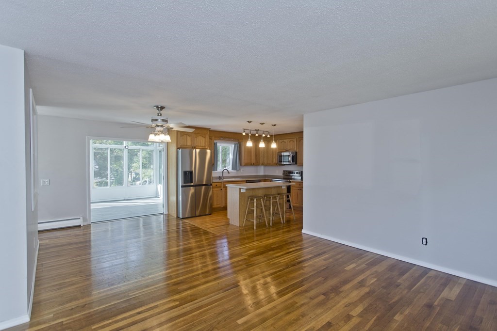 61 Arbor Road Enfield, CT 06082 - Photo 4 of 39 a view of a kitchen with kitchen island wooden floor and stainless steel appliances