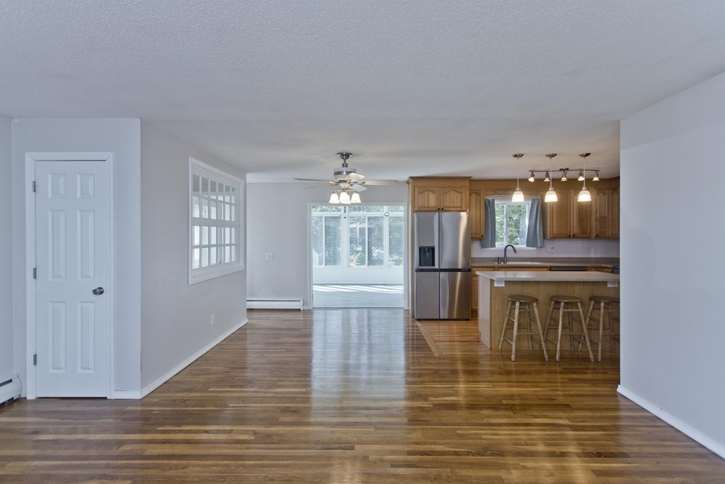 61 Arbor Road Enfield, CT 06082 - Photo 6 of 39 a view of a kitchen with kitchen island wooden floor and entryway