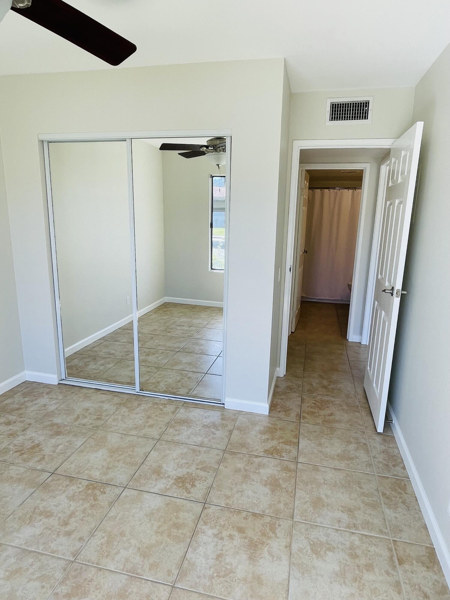 43376 Cook Street, Unit 38 Palm Desert, CA 92211 - Photo 13 of 33 an empty room with a natural light