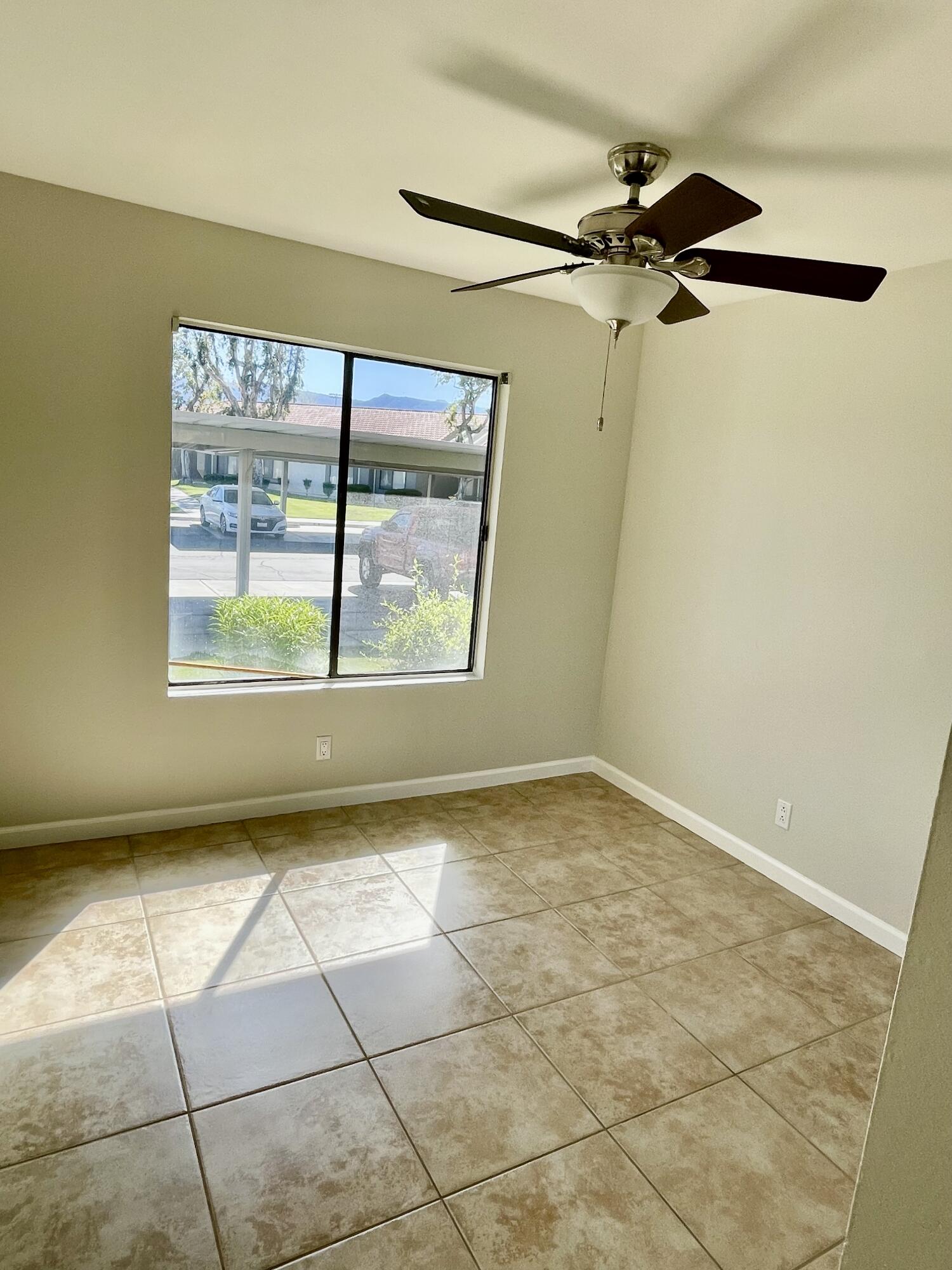 43376 Cook Street, Unit 38 Palm Desert, CA 92211 - Photo 14 of 33 a view of an empty room with a window