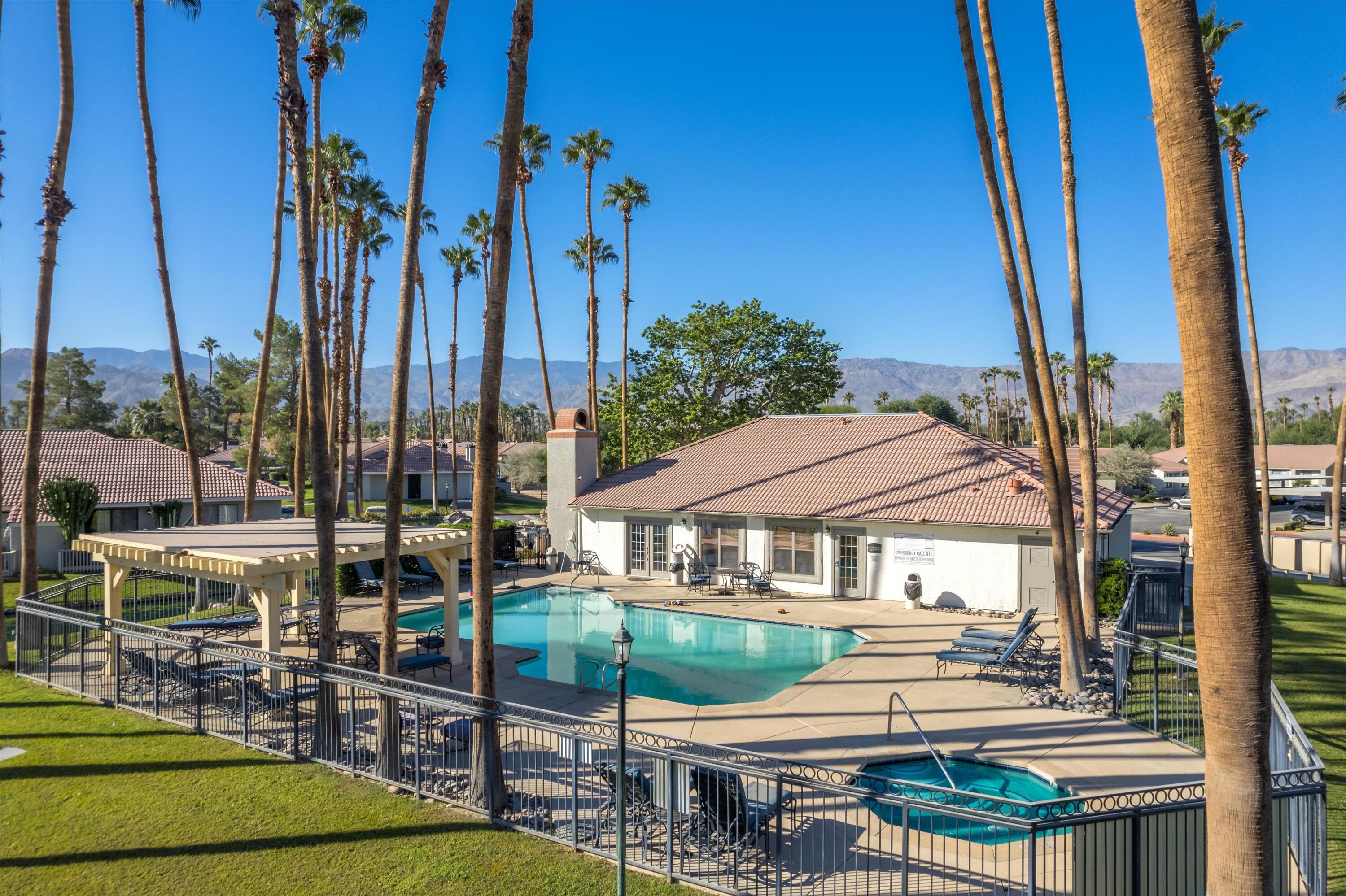 43376 Cook Street, Unit 38 Palm Desert, CA 92211 - Photo 24 of 33 a view of house with yard outdoor seating and city view