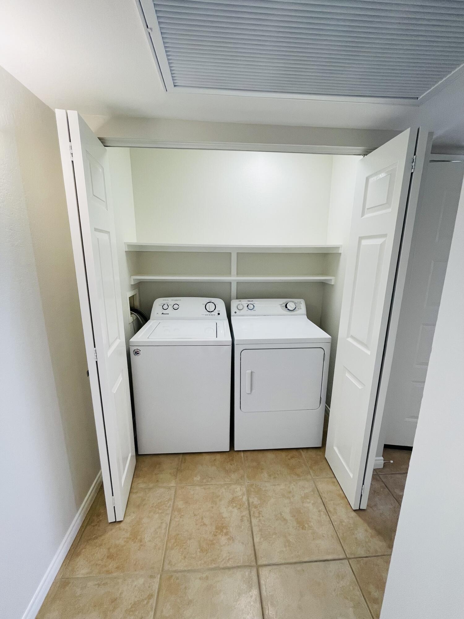 43376 Cook Street, Unit 38 Palm Desert, CA 92211 - Photo 7 of 33 a utility room with dryer and washer