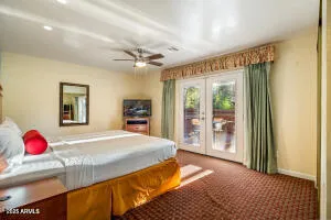 a bedroom with a bed and a dresser