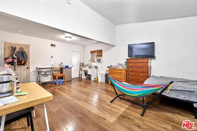 a room with furniture and wooden floor