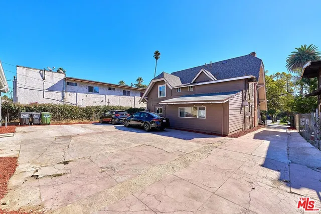 a view of a car park in front of house