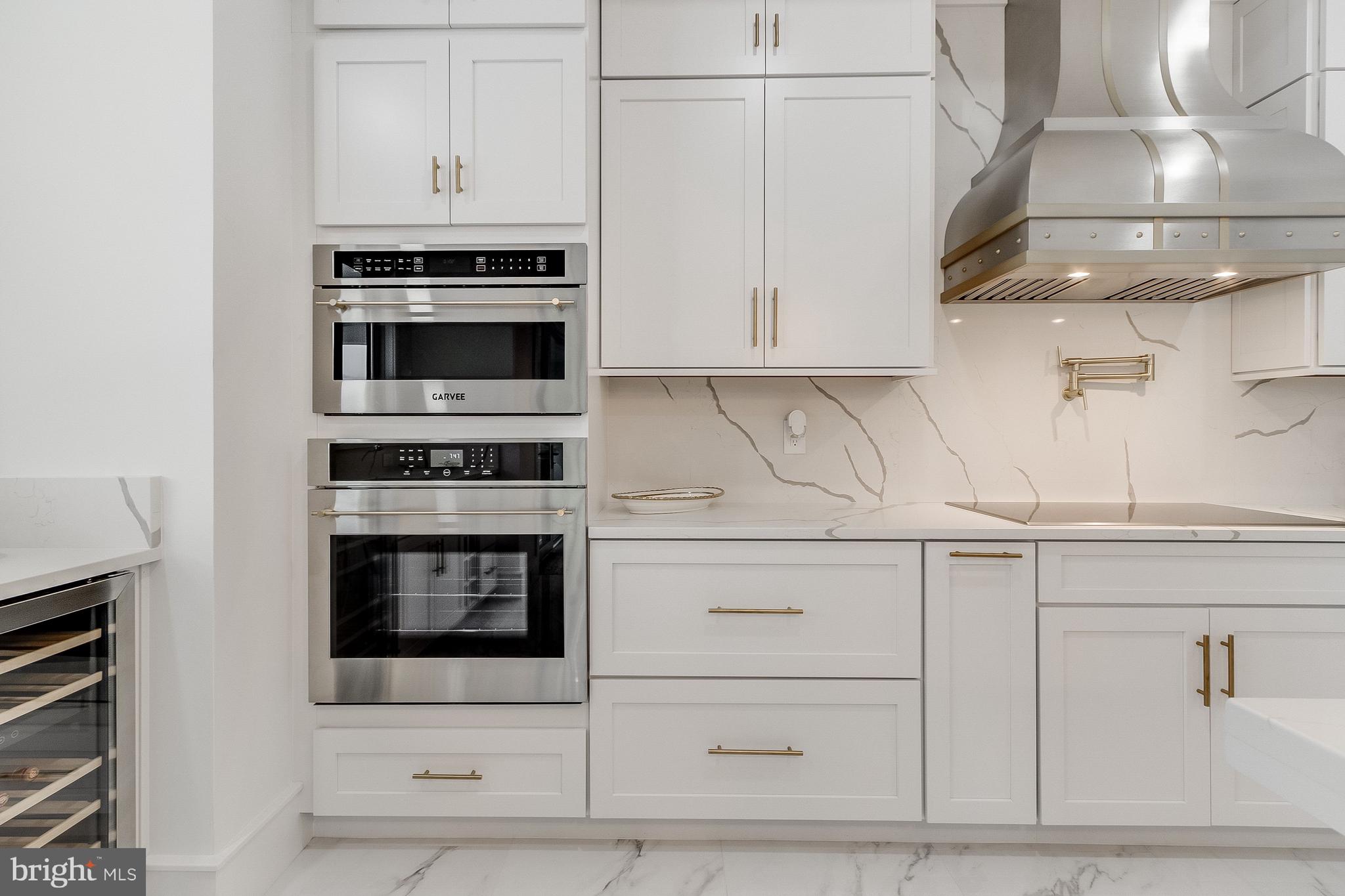 20157 West Piney Grove Road Georgetown, DE 19947 - Photo 15 of 104 a kitchen with stainless steel appliances granite countertop a stove and a microwave
