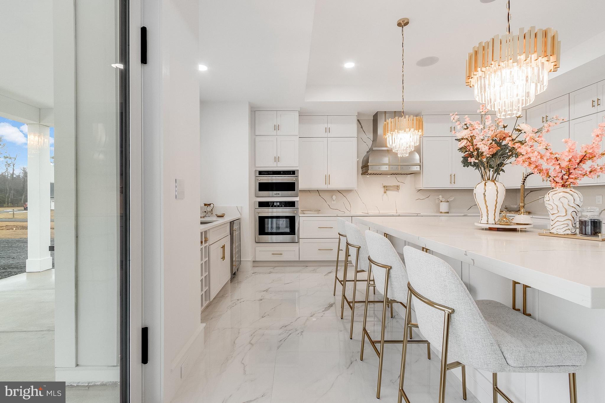 20157 West Piney Grove Road Georgetown, DE 19947 - Photo 16 of 104 a kitchen with kitchen island cabinets and refrigerator