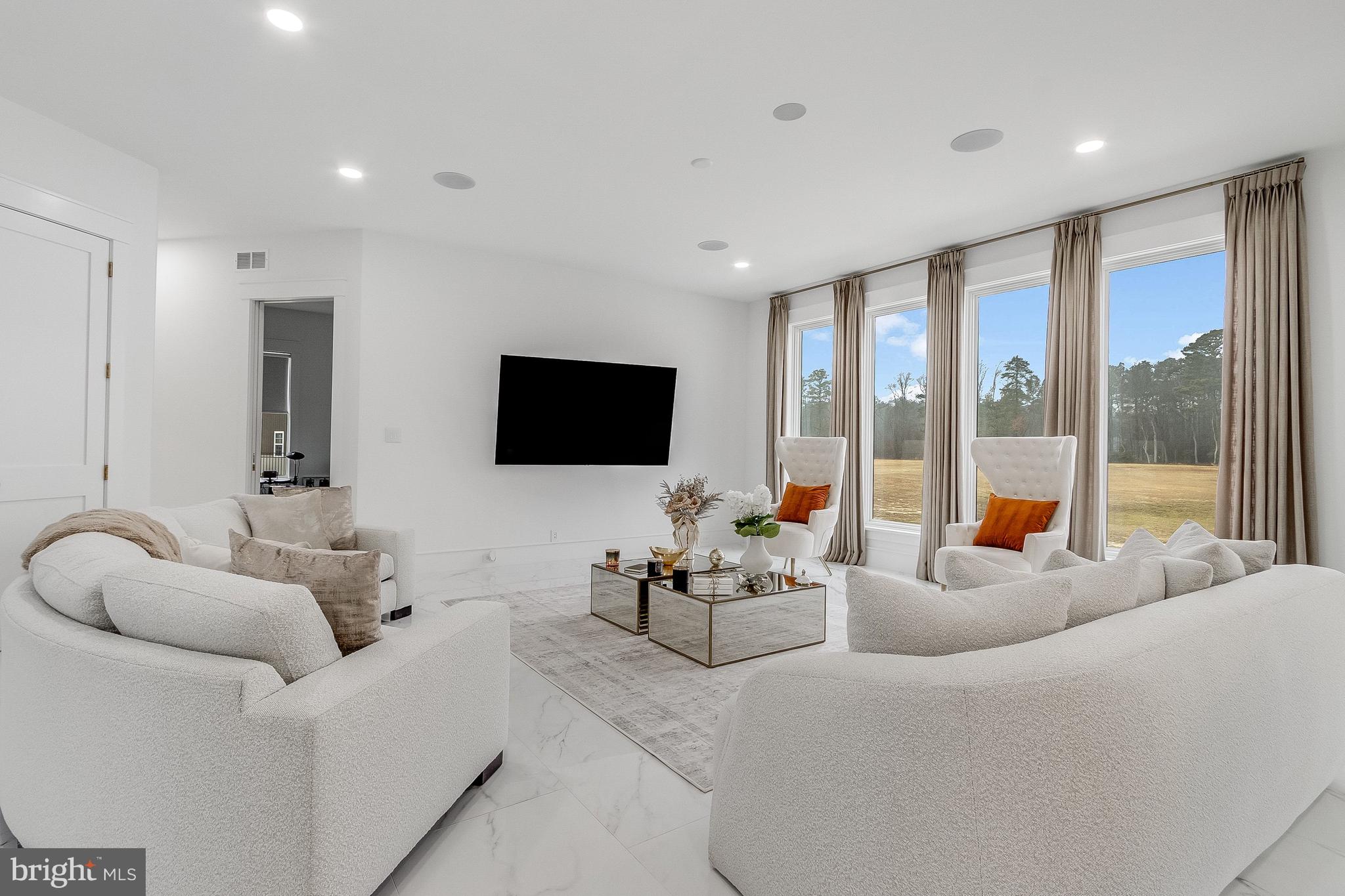 20157 West Piney Grove Road Georgetown, DE 19947 - Photo 27 of 104 a living room with furniture and a flat screen tv