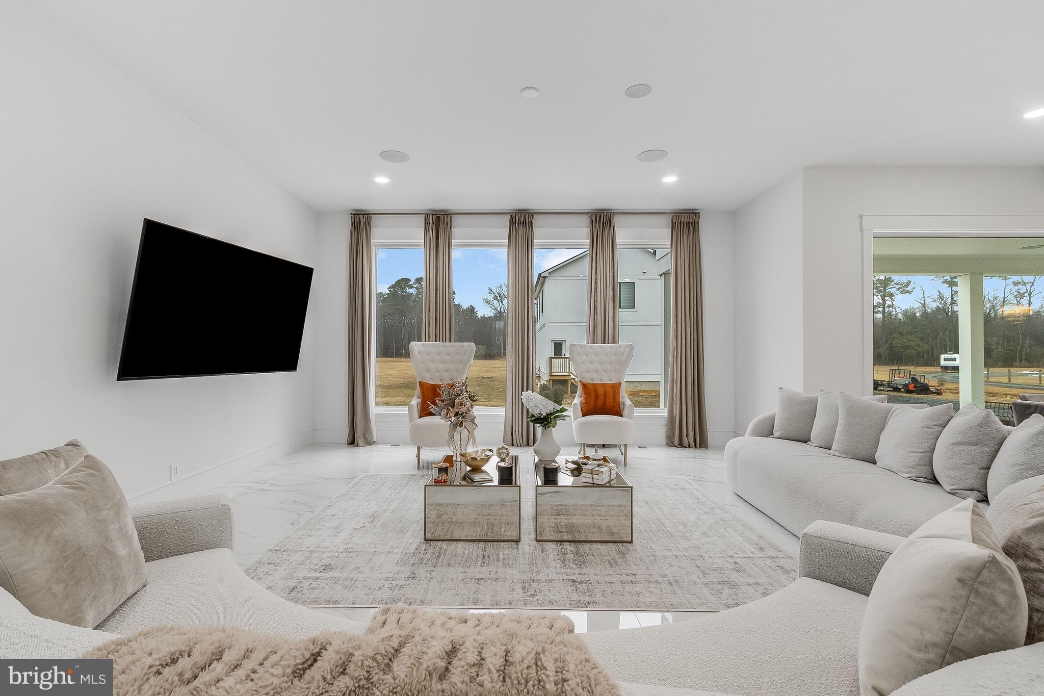 20157 West Piney Grove Road Georgetown, DE 19947 - Photo 29 of 104 a living room with furniture and a flat screen tv
