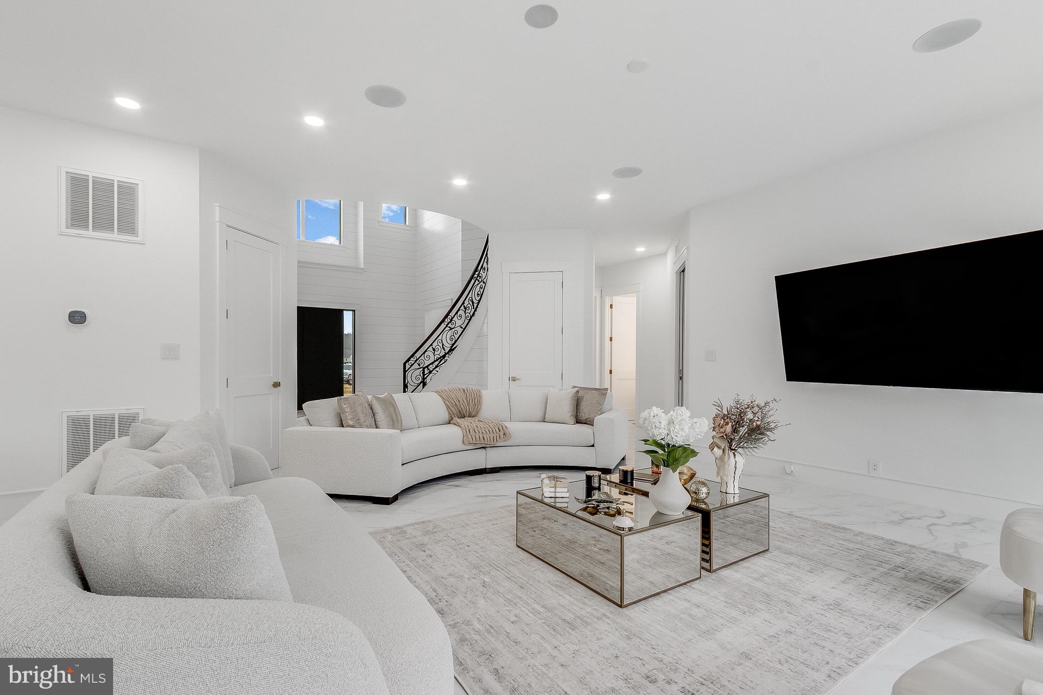 20157 West Piney Grove Road Georgetown, DE 19947 - Photo 34 of 104 a living room with furniture and a flat screen tv