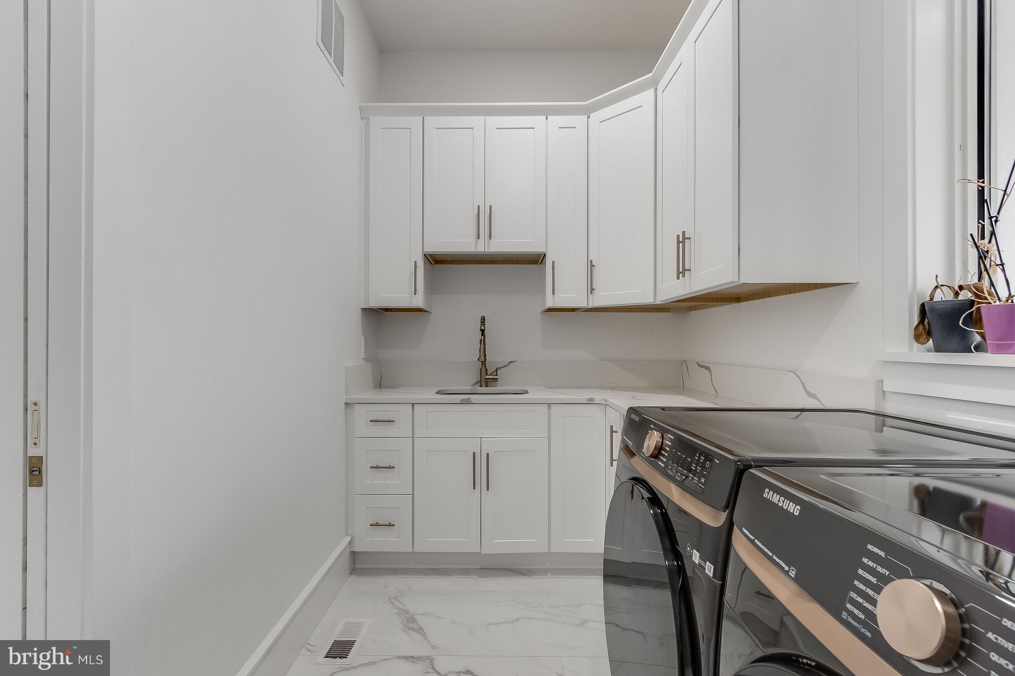 20157 West Piney Grove Road Georgetown, DE 19947 - Photo 42 of 104 a kitchen with a sink and cabinets