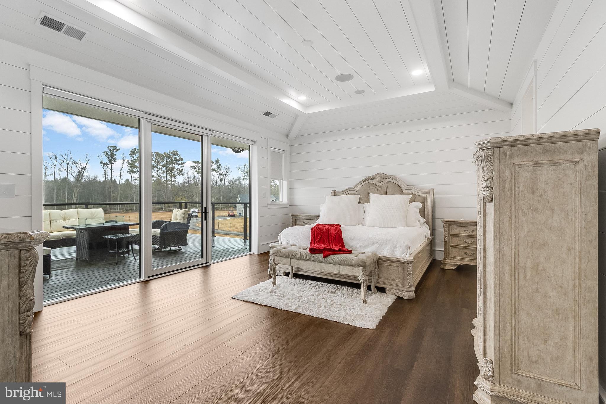 20157 West Piney Grove Road Georgetown, DE 19947 - Photo 43 of 104 a living room with furniture and a wooden floor