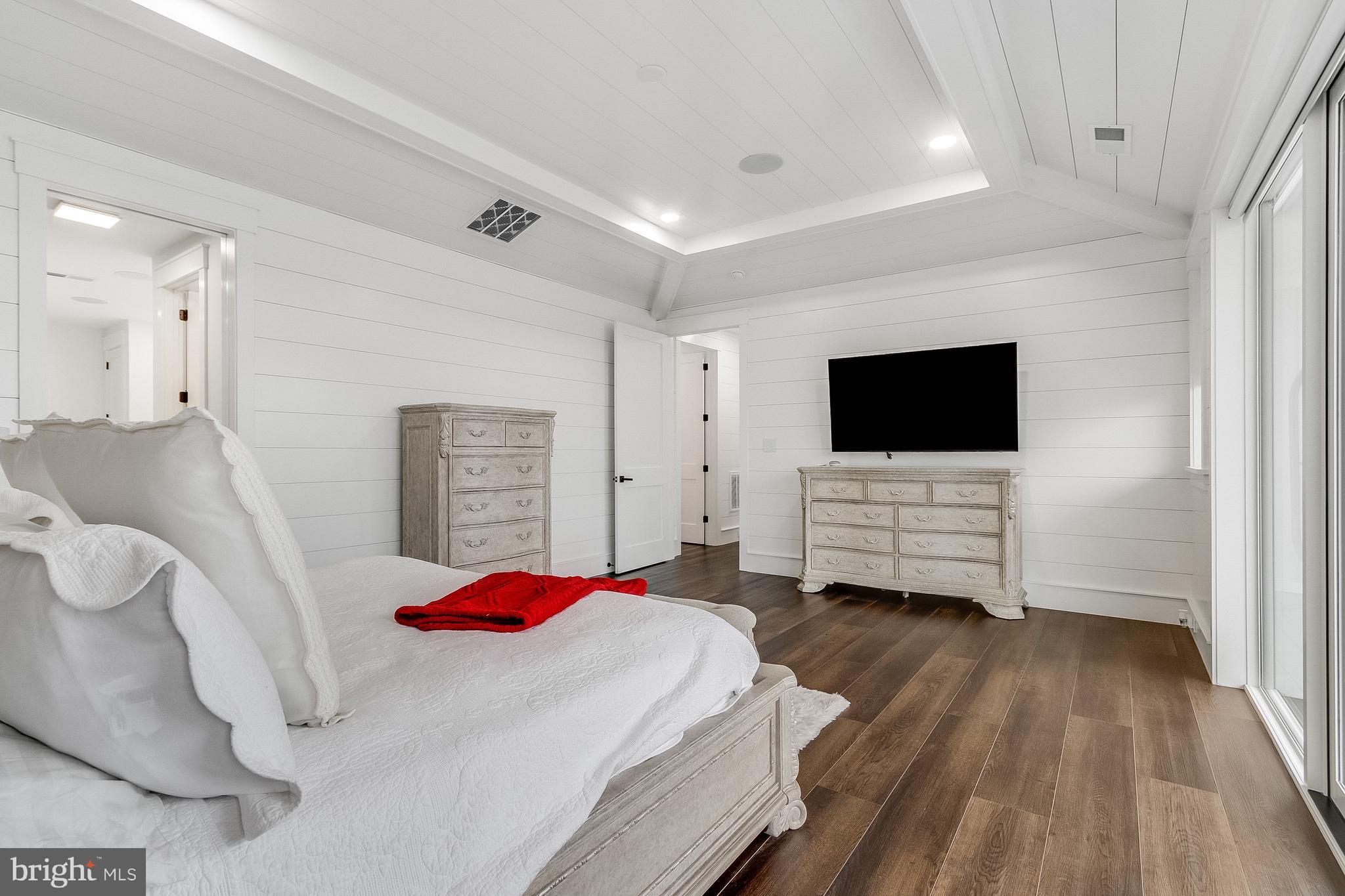 20157 West Piney Grove Road Georgetown, DE 19947 - Photo 45 of 104 a bedroom with a bed and a flat screen tv