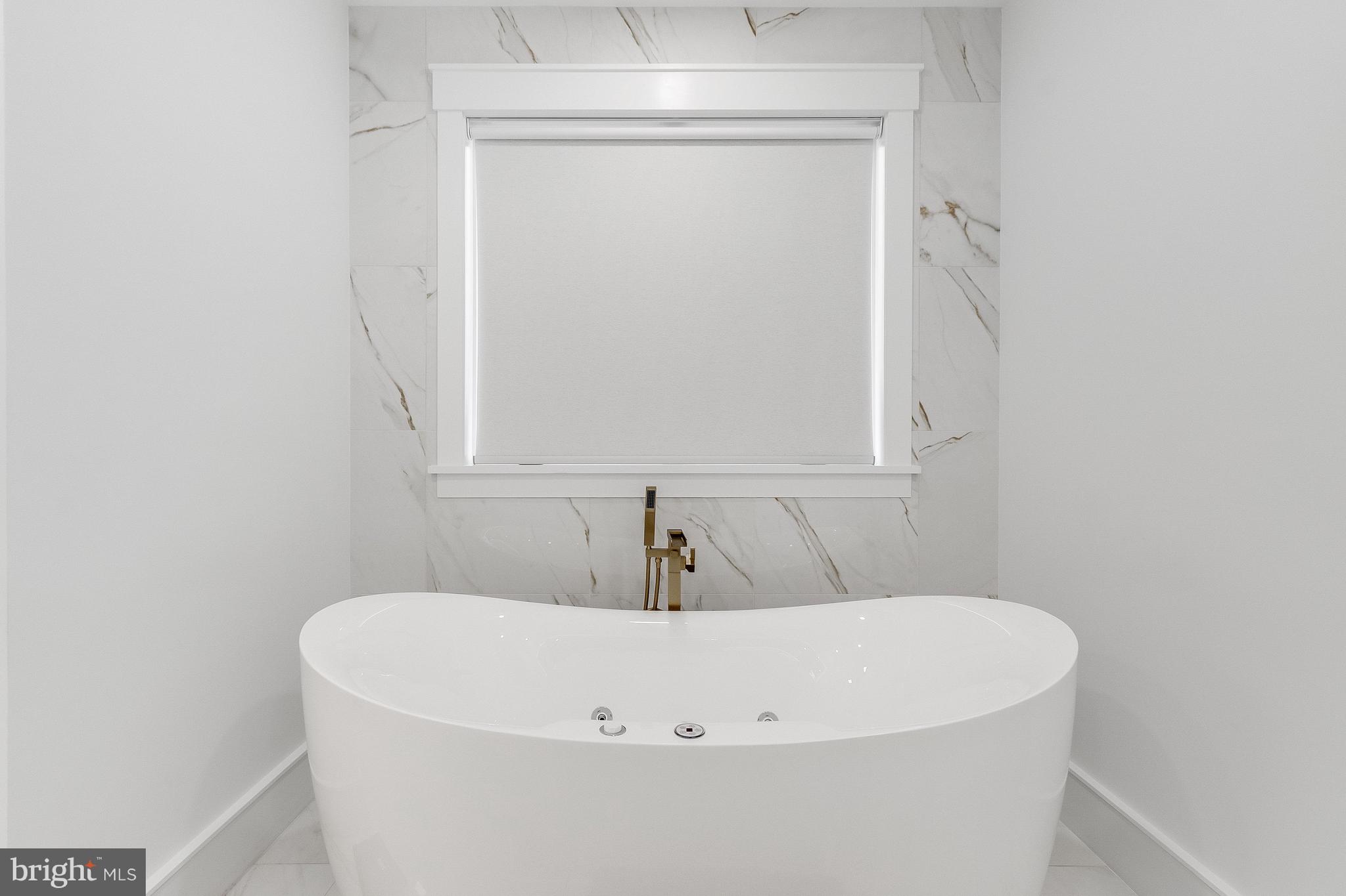 20157 West Piney Grove Road Georgetown, DE 19947 - Photo 55 of 104 a white bath tub sitting in a bathroom