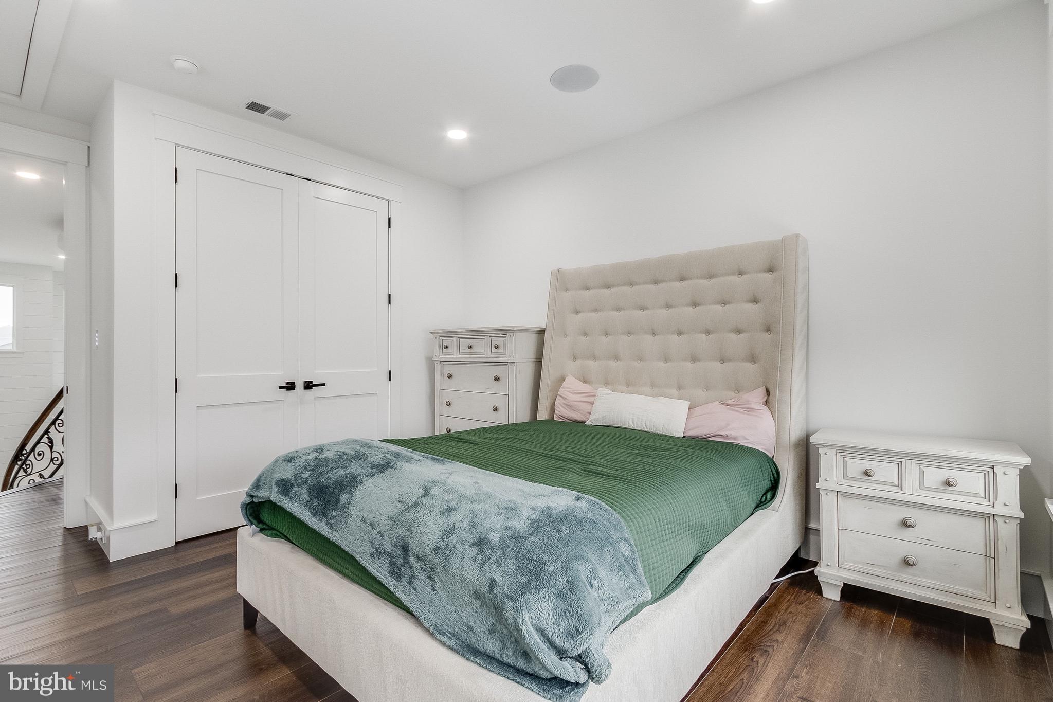 20157 West Piney Grove Road Georgetown, DE 19947 - Photo 63 of 104 a bedroom with a bed and a dresser