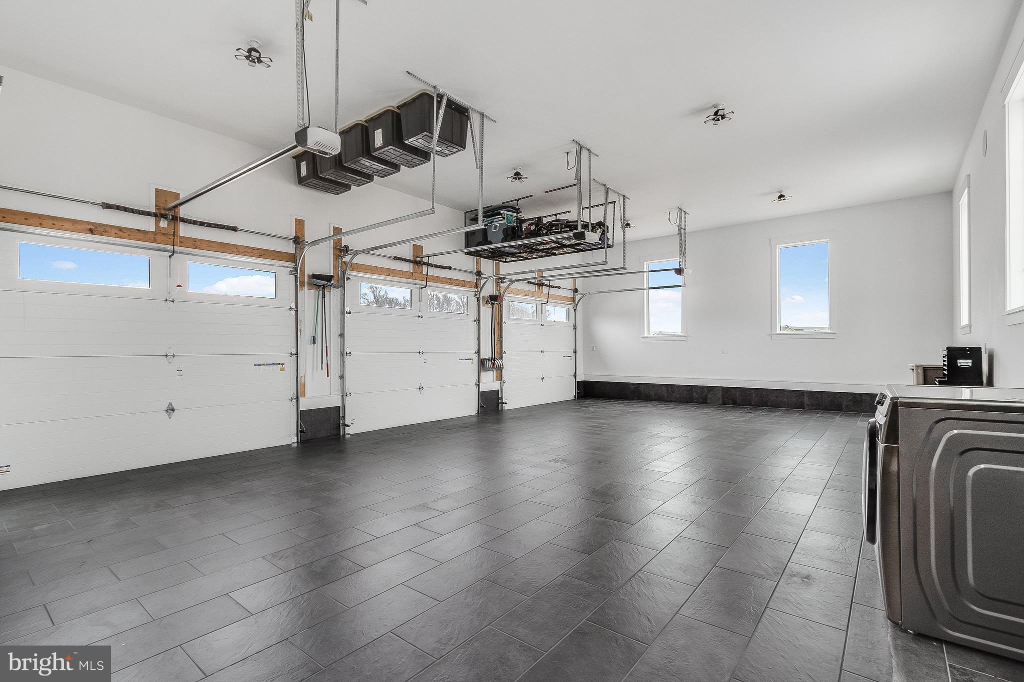 20157 West Piney Grove Road Georgetown, DE 19947 - Photo 78 of 104 a view of a kitchen with a stove wooden cabinets and wooden floor