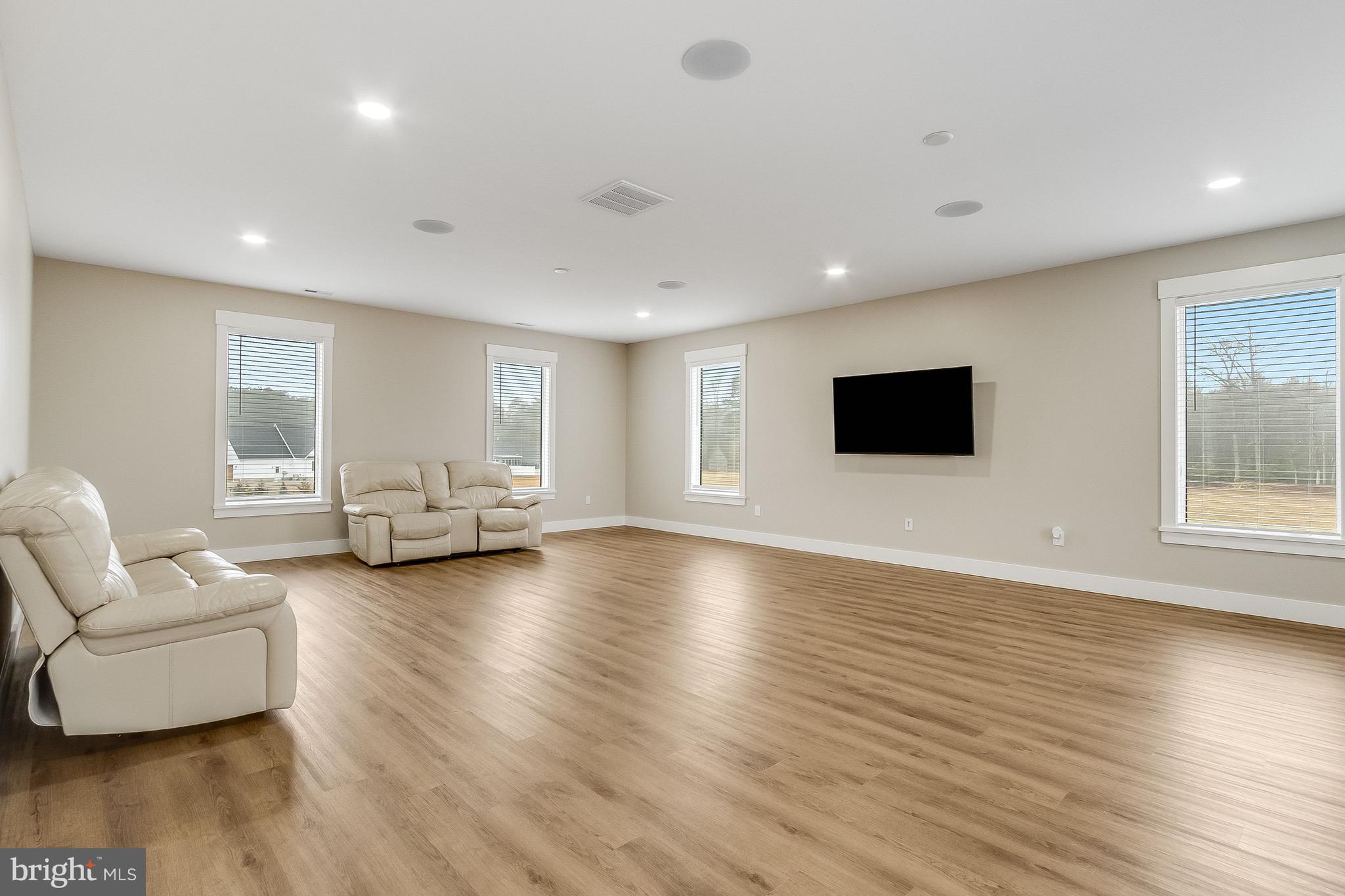 20157 West Piney Grove Road Georgetown, DE 19947 - Photo 86 of 104 a living room with furniture and a flat screen tv