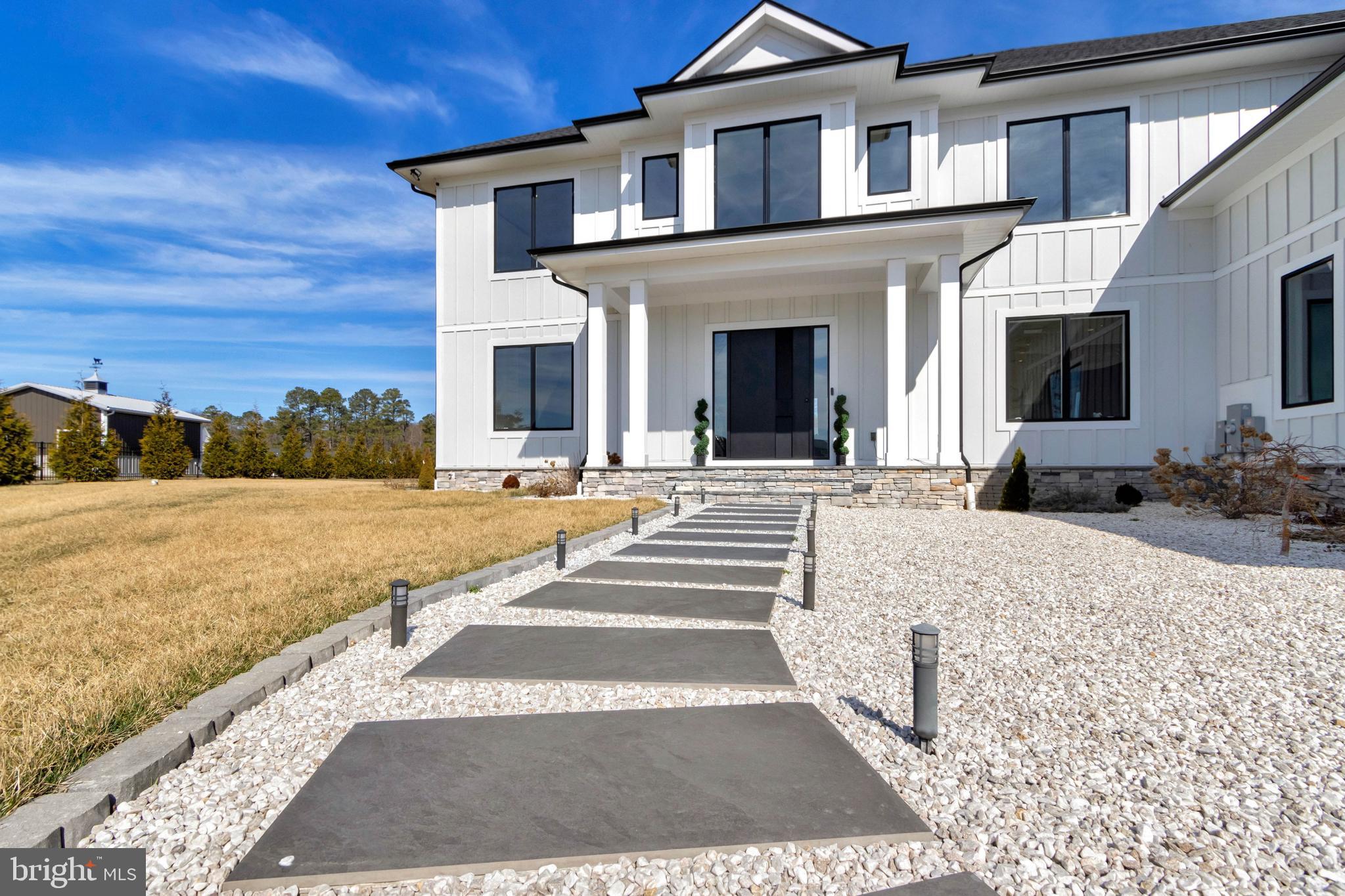 20157 West Piney Grove Road Georgetown, DE 19947 - Photo 99 of 104 a view of a house with a yard