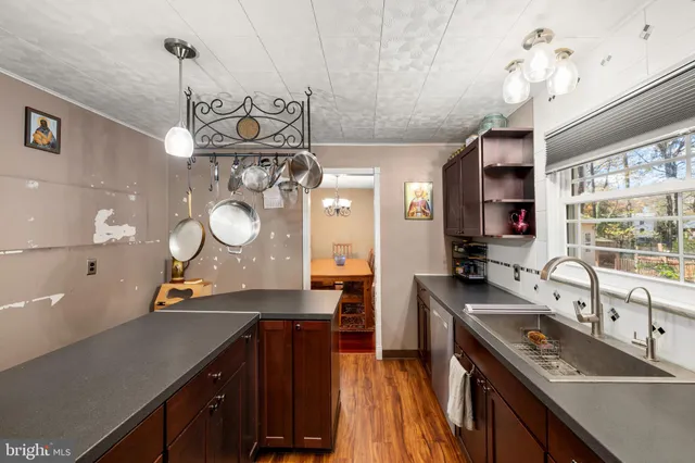 a kitchen with a sink stove and refrigerator