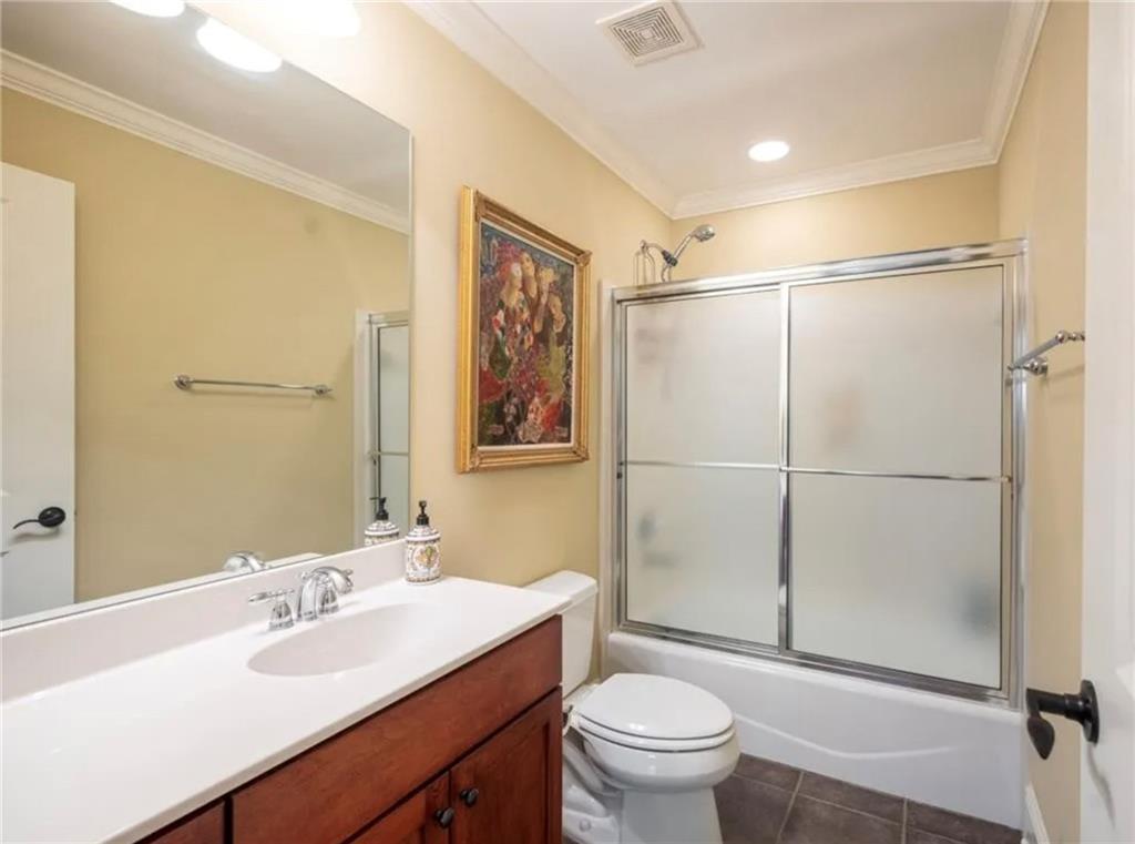 1060 Tailwater, Unit F Greensboro, GA 30642 - Photo 16 of 24 a bathroom with a sink toilet and shower