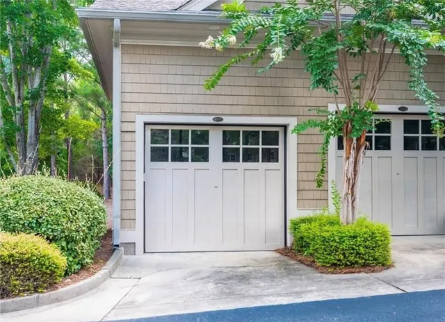 a view of small house with potted plants