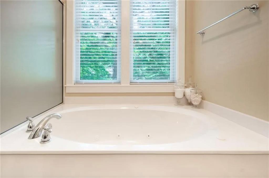 1060 Tailwater, Unit F Greensboro, GA 30642 - Photo 18 of 24 a white bath tub sitting next to a window